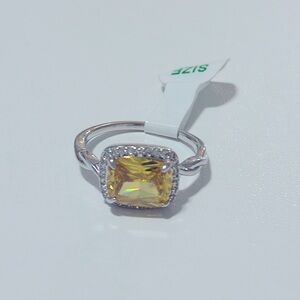 Bella Bomb ring with a yellow stone and set in sterling silver